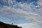 Silhouette of a cross country cyclist going downhill