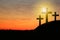Silhouette of crosses on hill at sunset, space for text