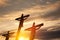 Silhouette of the crucified Jesus Christ on the cross along with other people on background of sunset.