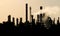 Silhouette of crude oil refinery station during dusk