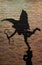 Silhouette of cupid painting on the bricked wall, vertical photo
