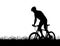 Silhouette of a cyclist on a mountain bike