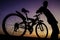 Silhouette of cyclist with twilight sky