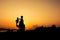 Silhouette of dad and son plan plane sunset