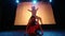 A Silhouette dancer accompanies the woman dancer to move together while dancing