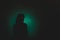 Silhouette of depress woman standing in the dark with light shin