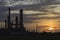 Silhouette depth of field the Oil Refinery with steam at Sunrise