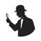 Silhouette of a detective with magnifier