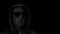 Silhouette of digital man in hood and sunglasses