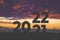 silhouette of digits 2022 on a sunset background. change of year 2021