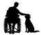 Silhouette disabled man in a wheelchair stroking his dog