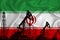 Silhouette of drilling rigs and oil derricks on the background of the flag of Iran. Oil and gas industry. The concept of oil