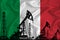 Silhouette of drilling rigs and oil derricks on the background of the flag of Italy. Oil and gas industry. The concept of oil