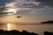 Silhouette Of Drone Flying Over Pier. Sunrise From Corfu Island Overlooking Mountains Of Balkan Peninsula Of Greece, Moraitika,