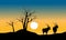 Silhouette of dry tree and antelope