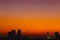 Silhouette dusk city quiet calm sunset sky no cloud orange sky view space for text