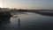 Silhouette elderly man walking with cane on the water near the ocean during sunset in Morocco