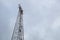 Silhouette of electricity post on blue sky background,low angle shot,high voltage electric pole, power supply cloudy d