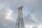 Silhouette of electricity post on blue sky background,low angle shot,high voltage electric pole, power supply cloudy d