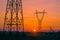 Silhouette electricity pylons