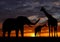 Silhouette elephants and giraffe