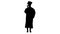 Silhouette Emotional female student in graduation robe talking on the phone holding diploma.