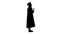 Silhouette Emotional female student in graduation robe talking on the phone holding diploma.