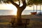 Silhouette empty bench at the sunset beach