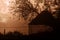 Silhouette of  empty corn-crib at sunrise