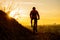 Silhouette of Enduro Cyclist Riding the Mountain Bike on the Rocky Trail at Sunset. Active Lifestyle Concept. Space for Text.