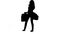 Silhouette of an energetic woman holding shopping bags