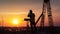 Silhouette of Engineer checking project at building site background, construction site at sunset in evening time