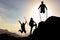 Silhouette and enthusiasm of energetic, active and successful climbers