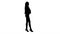 Silhouette Excited woman talking on mobile phone with shopping bags.