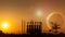 Silhouette of factory at sunset.Fantasy world.Image of earth planet. Elements of this image are furnished by NASA