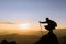 Silhouette of female climber on the top of the mountain, trekking,  success, competition and leader concept