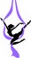 Silhouette of female dancer on purple aerial silk