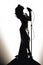 Silhouette of a female diva vocalist