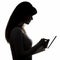 Silhouette of female profile with tablet, girl with electronic device in hands