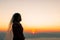 Silhouette of female during sunrise with morning sky background. Pre-wedding portraits happy images woman with sky nature