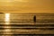 Silhouette of female swimmer going into the Atlantic ocean in Ireland