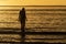 Silhouette of female swimmer going into the Atlantic ocean in Ireland