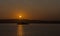 Silhouette Ferry Under Setting Sun