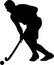 Silhouette of field hockey player with a hockey stick