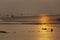 Silhouette of fisherman at oyster farm on sunrise background in Bang Taboon, Thailand