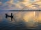The silhouette of Fisherman throwing net in the early morning near U Bein Bridge, , Taungthaman Lake near Amarapura, Myanma