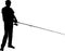 Silhouette of a fisherman who catches a fish on a spinning