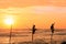 Silhouette of fishermen at sunset, Unawatuna, Sri Lanka