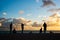 Silhouette of fishermen and their poles at Ponta do Humaita, Salvador