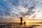 Silhouette of Fishermen throwing net fishing in sunset time at W